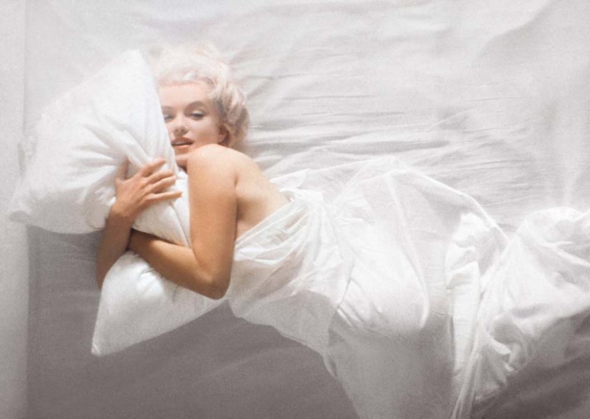 Marilyn Monroe hugging pillow